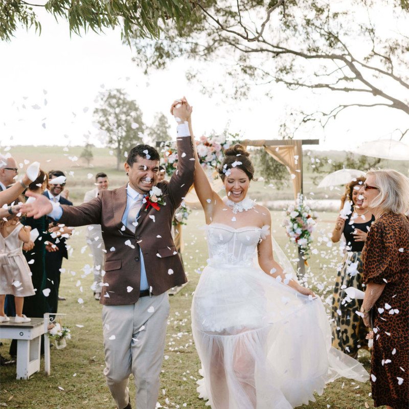 A confetti exit, the couple cheering